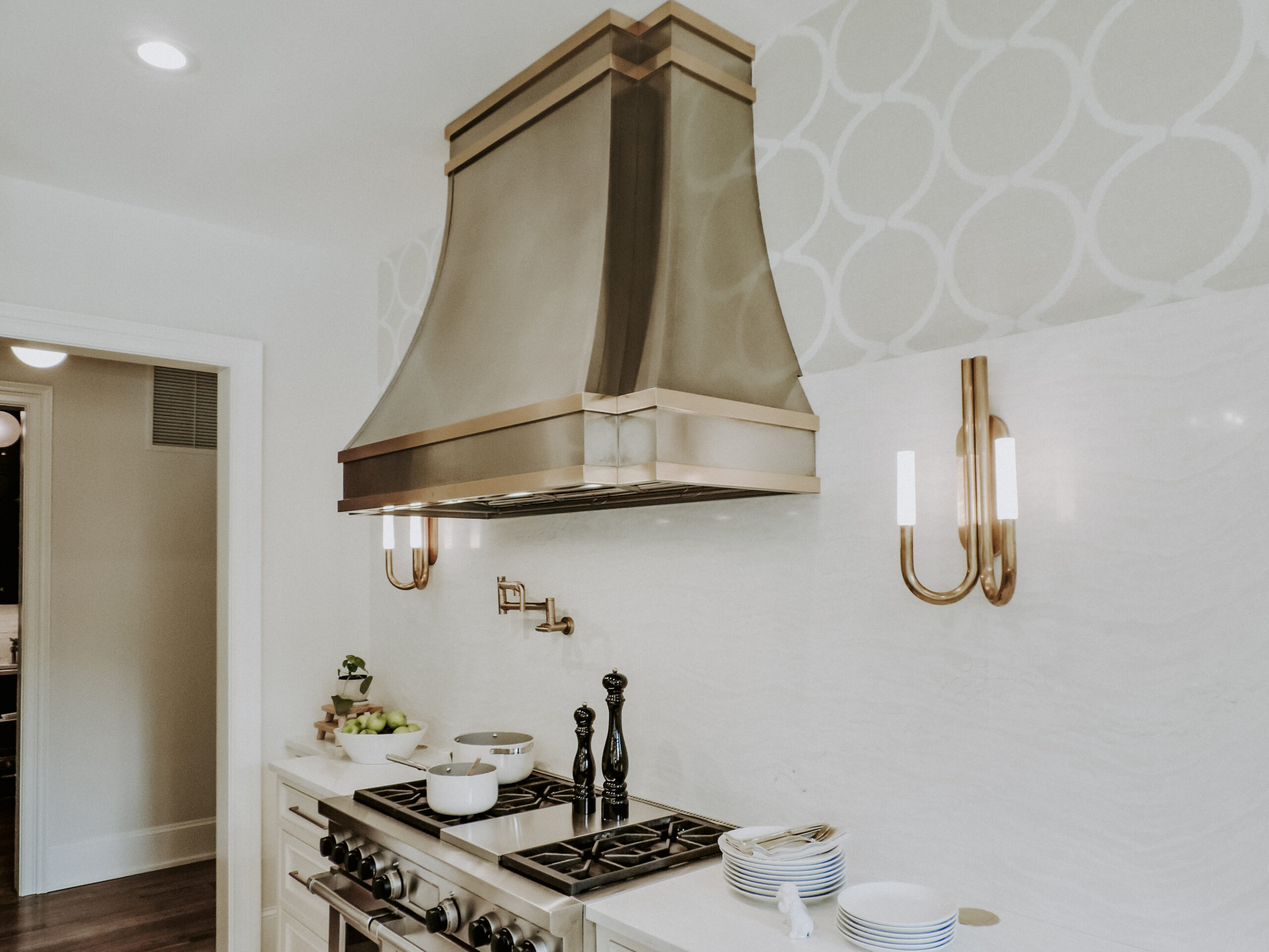 Modern kitchen, gold range hood.